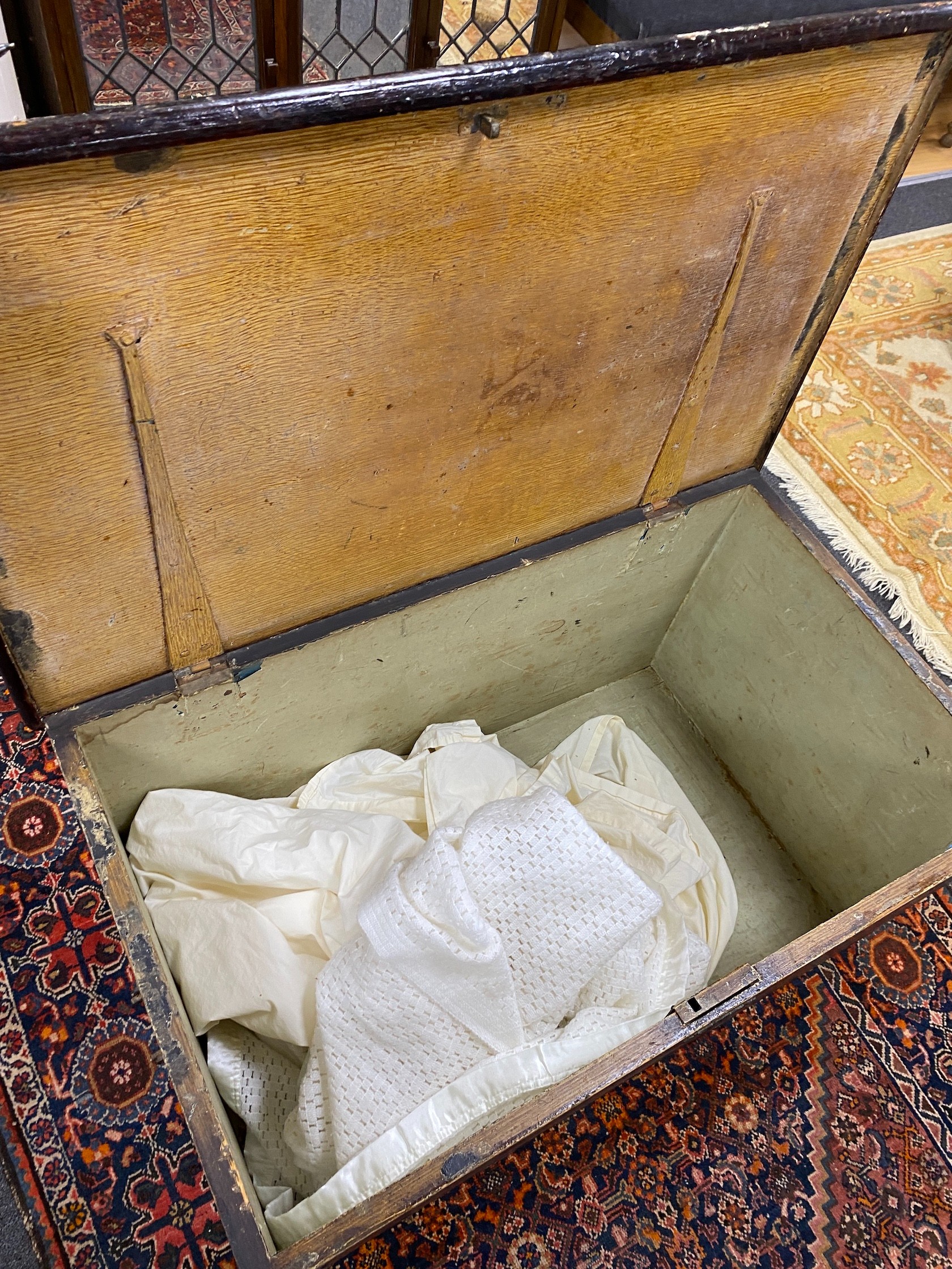 A Victorian rectangular stained pine trunk, width 94cm, depth 56cm, height 48cm.